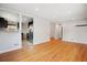 Spacious living room featuring hardwood floors, open layout, and seamless transition to the kitchen at 4780 E Montana Pl, Denver, CO 80222