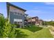 Grassy backyard featuring lush landscaping, a private patio, and an inviting atmosphere for outdoor enjoyment at 817 Backcountry Ln, Highlands Ranch, CO 80126