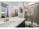 Modern bathroom featuring a glass enclosed shower, and a white countertop with black cabinetry at 817 Backcountry Ln, Highlands Ranch, CO 80126