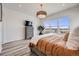Comfortable bedroom with large windows offering scenic views, modern decor, and stylish furnishings at 817 Backcountry Ln, Highlands Ranch, CO 80126