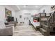 ' bedroom with bunk beds, gray wood flooring, and a large window for natural light at 817 Backcountry Ln, Highlands Ranch, CO 80126