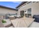 Inviting outdoor deck featuring wicker furniture, a fire pit, and a dining area for relaxing and entertaining at 817 Backcountry Ln, Highlands Ranch, CO 80126
