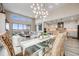 Bright living room with floor to ceiling fireplace and large windows, capturing the essence of modern comfort at 817 Backcountry Ln, Highlands Ranch, CO 80126