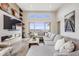 Bright living room with modern fireplace and large windows, capturing the essence of modern comfort at 817 Backcountry Ln, Highlands Ranch, CO 80126