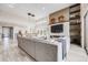 Bright living room showcasing fireplace, high ceilings, and modern light fixtures at 817 Backcountry Ln, Highlands Ranch, CO 80126