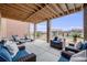Covered patio with comfortable seating, including lounge chairs, perfect for enjoying the outdoors at 817 Backcountry Ln, Highlands Ranch, CO 80126