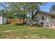 The property features a sprawling backyard bordered with wood fence for privacy at 4001 S Acoma St, Englewood, CO 80110