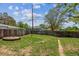 Fenced backyard with healthy lawn, convenient walkway and appealing landscaping at 4001 S Acoma St, Englewood, CO 80110