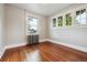 Bedroom features hardwood floors, radiator and a bright window at 4001 S Acoma St, Englewood, CO 80110