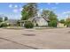 Charming corner lot home featuring a classic design, mature trees and lush landscaping at 4001 S Acoma St, Englewood, CO 80110
