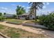 Inviting home exterior with a cozy front yard featuring steps to street access at 4001 S Acoma St, Englewood, CO 80110