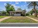 Charming front exterior with landscaped yard and covered porch at 4001 S Acoma St, Englewood, CO 80110