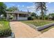Inviting home with a covered carport and a neatly landscaped front yard at 4001 S Acoma St, Englewood, CO 80110
