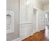 Hallway features custom built-ins and hardwood floors at 4001 S Acoma St, Englewood, CO 80110