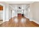 Spacious living room featuring hardwood floors, a fireplace, and an open layout at 4001 S Acoma St, Englewood, CO 80110