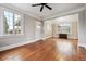 Living room featuring beautiful hardwood floors, large windows, and an open design at 4001 S Acoma St, Englewood, CO 80110
