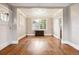 Inviting living room showcasing hardwood floors, decorative trim, and large windows at 4001 S Acoma St, Englewood, CO 80110