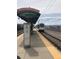 Oxford Station train stop, with a train approaching the platform and clear signage at 4001 S Acoma St, Englewood, CO 80110