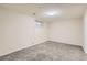 Finished basement with neutral walls, carpet flooring and a single basement window at 1737 Beeler St, Aurora, CO 80010