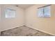 Cozy bedroom with gray carpet, neutral walls, and a window at 1737 Beeler St, Aurora, CO 80010