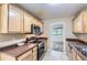 A view of kitchen appliances and an open door to the living room in a lovely home at 1737 Beeler St, Aurora, CO 80010
