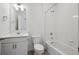 Clean white bathroom with a shower-tub combo and a modern vanity with ample storage at 4113 Marble Dr, Mead, CO 80504