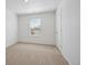 Neutral-colored bedroom with fresh paint, neutral carpet, and a window with light-filtering blinds at 4113 Marble Dr, Mead, CO 80504