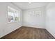 Bright bedroom with hardwood floors and large windows, offering plenty of natural light at 4113 Marble Dr, Mead, CO 80504