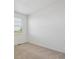 Bright bedroom featuring neutral carpet, fresh paint, and a window providing natural light at 4113 Marble Dr, Mead, CO 80504