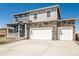 Lovely two-story home featuring a stone facade, a covered porch, and a convenient three-car garage at 4113 Marble Dr, Mead, CO 80504