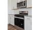 Close-up of stainless steel oven and microwave with granite countertops and subway tile backsplash at 4113 Marble Dr, Mead, CO 80504