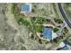An aerial shot shows the home's location with a long driveway to the road and a nearby structure at 4781 Mariposa Rd, Castle Rock, CO 80104