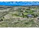Expansive aerial view of a sprawling property with well-manicured lawns and multiple buildings at 4781 Mariposa Rd, Castle Rock, CO 80104