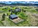 Aerial view of a home and fenced in horse property on large lot in a verdant countryside setting at 4781 Mariposa Rd, Castle Rock, CO 80104