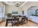 Elegant dining room with modern lighting, and a view into the living space at 4781 Mariposa Rd, Castle Rock, CO 80104