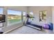 Bright exercise room with a treadmill and expansive windows showcasing panoramic views of the surrounding landscape at 4781 Mariposa Rd, Castle Rock, CO 80104