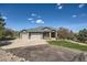Charming home featuring a well-maintained yard, stone accents, and a three-car garage at 4781 Mariposa Rd, Castle Rock, CO 80104