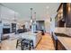 Beautiful kitchen with an island, updated appliances, and an open layout to the living area at 4781 Mariposa Rd, Castle Rock, CO 80104