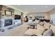 Spacious basement living room features stone fireplace and comfortable seating area, perfect for entertaining at 4781 Mariposa Rd, Castle Rock, CO 80104