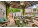Inviting covered patio featuring comfortable seating and stylish decor, ideal for outdoor relaxation and entertaining at 5323 E Sandpiper Ave, Castle Rock, CO 80104