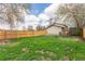 Spacious fenced backyard with a well-maintained lawn, perfect for outdoor activities at 778 2Nd St, Firestone, CO 80520
