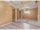 Spacious basement area with both hard surface flooring and carpet along with a ceiling fan at 778 2Nd St, Firestone, CO 80520