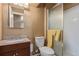 The bathroom features a mirrored vanity and a glass shower at 778 2Nd St, Firestone, CO 80520