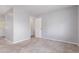 Bedroom with light gray walls, carpet, and white door creating a bright, airy atmosphere at 778 2Nd St, Firestone, CO 80520