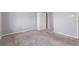 Spacious bedroom with gray carpet, light gray walls, white trim and a built-in closet at 778 2Nd St, Firestone, CO 80520