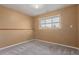 This carpeted bedroom has a good sized window for natural light at 778 2Nd St, Firestone, CO 80520