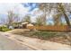 Charming home with a neatly fenced backyard, lush trees, and an attached garage, offering both privacy and convenience at 778 2Nd St, Firestone, CO 80520