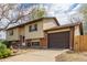 Charming two-story home featuring brick accents, a well-maintained lawn, and an attached two-car garage at 778 2Nd St, Firestone, CO 80520
