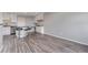 Modern kitchen featuring white cabinets, stainless steel appliances, and stylish breakfast bar seating at 778 2Nd St, Firestone, CO 80520