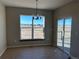 Dining room with large windows and sliding glass doors to deck at 39110 E 146Th Ct, Keenesburg, CO 80643